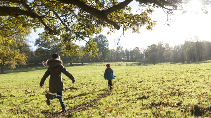 Children running on the estate at Scotney Castle